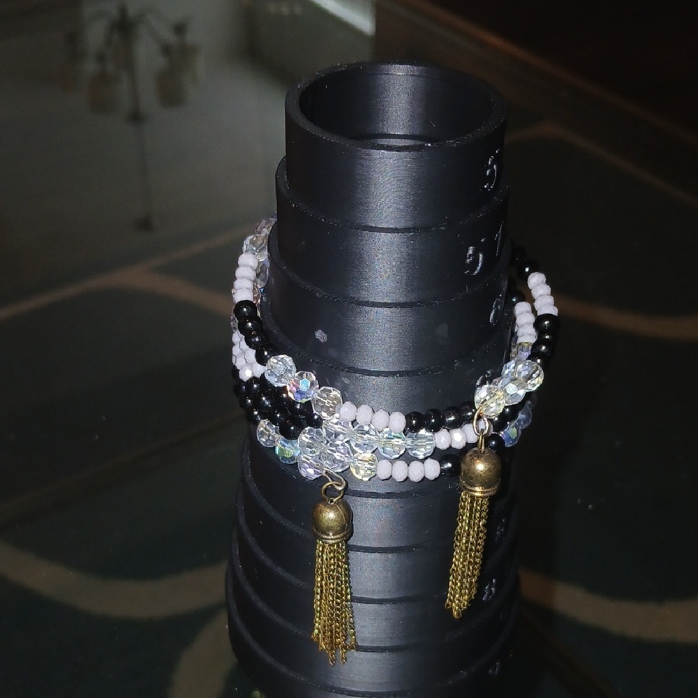 Elegant Black and Gold Beaded Bracelet with Tassels